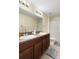 Bathroom featuring a double vanity with ample counter space and stylish decor at 21046 Passive Porch Dr, Land O Lakes, FL 34637