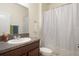 Bathroom featuring a granite countertop vanity and shower/tub at 21046 Passive Porch Dr, Land O Lakes, FL 34637