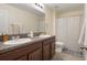 The bathroom features a double vanity and ample counter space at 21046 Passive Porch Dr, Land O Lakes, FL 34637