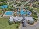 Aerial view of a community pool featuring a resort-style pool and separate lap pool at 21046 Passive Porch Dr, Land O Lakes, FL 34637