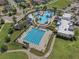 Aerial view of a community pool featuring a resort-style pool and separate lap pool at 21046 Passive Porch Dr, Land O Lakes, FL 34637