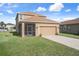 Charming two-story home featuring a screened porch and a convenient two-car garage at 21046 Passive Porch Dr, Land O Lakes, FL 34637