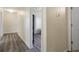 Hallway with wood-look floors and neutral paint at 21046 Passive Porch Dr, Land O Lakes, FL 34637