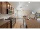 Kitchen features granite countertops, stainless steel appliances, and an open layout at 21046 Passive Porch Dr, Land O Lakes, FL 34637