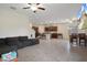 Open living area seamlessly connects to the kitchen and dining, with tile flooring, a spacious layout, and great natural light at 21046 Passive Porch Dr, Land O Lakes, FL 34637
