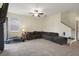 Bright living room features tiled floors, comfortable seating, and a staircase, creating an inviting and functional space at 21046 Passive Porch Dr, Land O Lakes, FL 34637