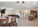 Spacious living area with tile floors, an open concept design, and a seamless flow between kitchen, living, and dining areas at 21046 Passive Porch Dr, Land O Lakes, FL 34637