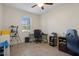 Cozy home office with a large window providing natural light and tiled flooring for a clean look at 21046 Passive Porch Dr, Land O Lakes, FL 34637