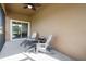 Relaxing screened porch with comfortable seating and ceiling fan, perfect for enjoying the outdoors at 21046 Passive Porch Dr, Land O Lakes, FL 34637