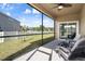 Relaxing screened porch with views and outdoor seating, perfect for enjoying the outdoors at 21046 Passive Porch Dr, Land O Lakes, FL 34637