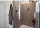 Tiled shower with glass door and shower head at 21046 Passive Porch Dr, Land O Lakes, FL 34637