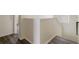 Hallway with wood-look floors and neutral paint at 21046 Passive Porch Dr, Land O Lakes, FL 34637