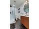 Stylish bathroom with a glass shower, matte black fixtures, and a modern vanity at 2488 Del Rio Way, Dunedin, FL 34698