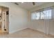 Bright bedroom with speckled floors and a sunlit window at 2488 Del Rio Way, Dunedin, FL 34698