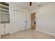 Bedroom featuring terrazzo floors, a ceiling fan, a closet and built-in shelving at 2488 Del Rio Way, Dunedin, FL 34698