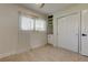 Cozy bedroom with a built-in shelf and cabinet, and double door closet at 2488 Del Rio Way, Dunedin, FL 34698