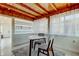 Bright dining room with wood ceiling, shelving, and natural light at 2488 Del Rio Way, Dunedin, FL 34698