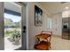 Bright entryway with terrazzo floors opens to a view of the front yard and kitchen at 2488 Del Rio Way, Dunedin, FL 34698