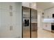 This updated kitchen features stainless steel appliances and custom white cabinetry with modern hardware at 2488 Del Rio Way, Dunedin, FL 34698