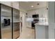 Bright kitchen featuring stainless steel appliances, white cabinetry, and unique terrazzo flooring at 2488 Del Rio Way, Dunedin, FL 34698