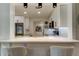 Bright, modern kitchen featuring sleek white cabinets and updated stainless appliances at 2488 Del Rio Way, Dunedin, FL 34698