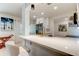 Bright kitchen featuring white cabinetry, stainless appliances, and a breakfast bar at 2488 Del Rio Way, Dunedin, FL 34698