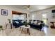 Bright, modern living room with an easy view of the front yard and kitchen bar at 2488 Del Rio Way, Dunedin, FL 34698