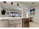 Bright and open living space viewed from the kitchen with a large farmhouse sink at 2488 Del Rio Way, Dunedin, FL 34698