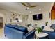 Modern living room with white shiplap and furnishings adjacent to the bright kitchen at 2488 Del Rio Way, Dunedin, FL 34698