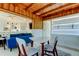 Open floor plan featuring dining room, living room with blue couch, and kitchen at 2488 Del Rio Way, Dunedin, FL 34698