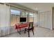 Bright office space with white wood floors, a large window, and a stylish desk setup, with a closet at 2488 Del Rio Way, Dunedin, FL 34698