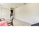 Bright office space with white wood floors, a large window, and minimalist decor, with white closet doors at 2488 Del Rio Way, Dunedin, FL 34698