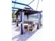 Stylish gazebo with comfortable seating, perfect for relaxing and enjoying outdoor views by the lake at 25417 Lexington Oaks Blvd, Wesley Chapel, FL 33544