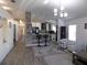 Open living space featuring a breakfast bar connecting to a modern kitchen, with stylish decor at 25417 Lexington Oaks Blvd, Wesley Chapel, FL 33544