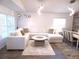 Stylish living area with contemporary lighting, comfortable seating, and elegant decor at 25417 Lexington Oaks Blvd, Wesley Chapel, FL 33544