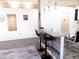 Open living space featuring a breakfast bar connecting to a modern kitchen, with stylish decor at 25417 Lexington Oaks Blvd, Wesley Chapel, FL 33544