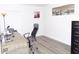 Bright office space featuring wood-look flooring, plenty of desk space and a bright window at 25417 Lexington Oaks Blvd, Wesley Chapel, FL 33544