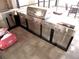 A stainless steel outdoor kitchen features a built-in grill, cabinets, and counter space at 25417 Lexington Oaks Blvd, Wesley Chapel, FL 33544