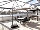 This gorgeous patio features outdoor seating and a gazebo with a gorgeous water view at 25417 Lexington Oaks Blvd, Wesley Chapel, FL 33544