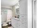 Clean bathroom with white vanity, flamingo shower curtain, and updated fixtures for a modern look at 2558 Arborwood Dr, Valrico, FL 33596
