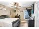 Cozy bedroom with ceiling fan, dark furniture, and charming decorations creating a relaxing atmosphere at 2558 Arborwood Dr, Valrico, FL 33596
