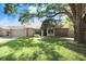Lovely one-story home with brick accents, well-maintained lawn, and an inviting front entrance with mature trees at 2558 Arborwood Dr, Valrico, FL 33596