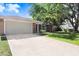 Charming single-story home boasting a brick facade and a spacious two-car garage and long driveway at 2558 Arborwood Dr, Valrico, FL 33596