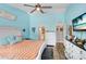Bright main bedroom with blue walls, vaulted ceilings, ceiling fan, and ensuite bathroom access at 2558 Arborwood Dr, Valrico, FL 33596
