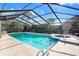 Inviting screened-in pool area with a hot tub; ideal for outdoor relaxation and entertainment at 2558 Arborwood Dr, Valrico, FL 33596