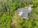 An aerial view of home surrounded by lush trees, showcasing its secluded location at 346 Ranch Rd, Tarpon Springs, FL 34688