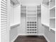 Walk-in closet with custom white shelving and rods for optimal storage at 346 Ranch Rd, Tarpon Springs, FL 34688