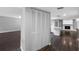 View of the entryway featuring new flooring and a glimpse of the fireplace and kitchen at 346 Ranch Rd, Tarpon Springs, FL 34688