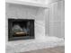 Close-up of stone fireplace with white mantel and hearth in a living room at 346 Ranch Rd, Tarpon Springs, FL 34688
