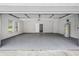 Spacious garage with epoxy flooring, and a well-lit interior at 346 Ranch Rd, Tarpon Springs, FL 34688